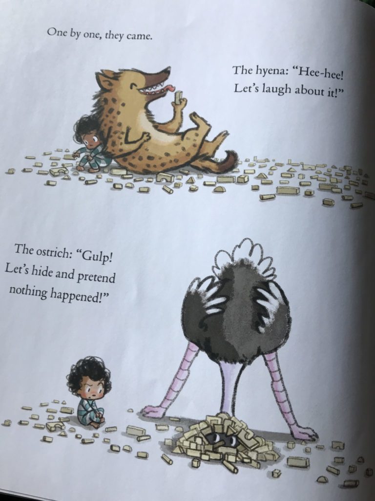 A page of the book shows a hyena laying on his back laughing and an ostrich with his head in the sand. 