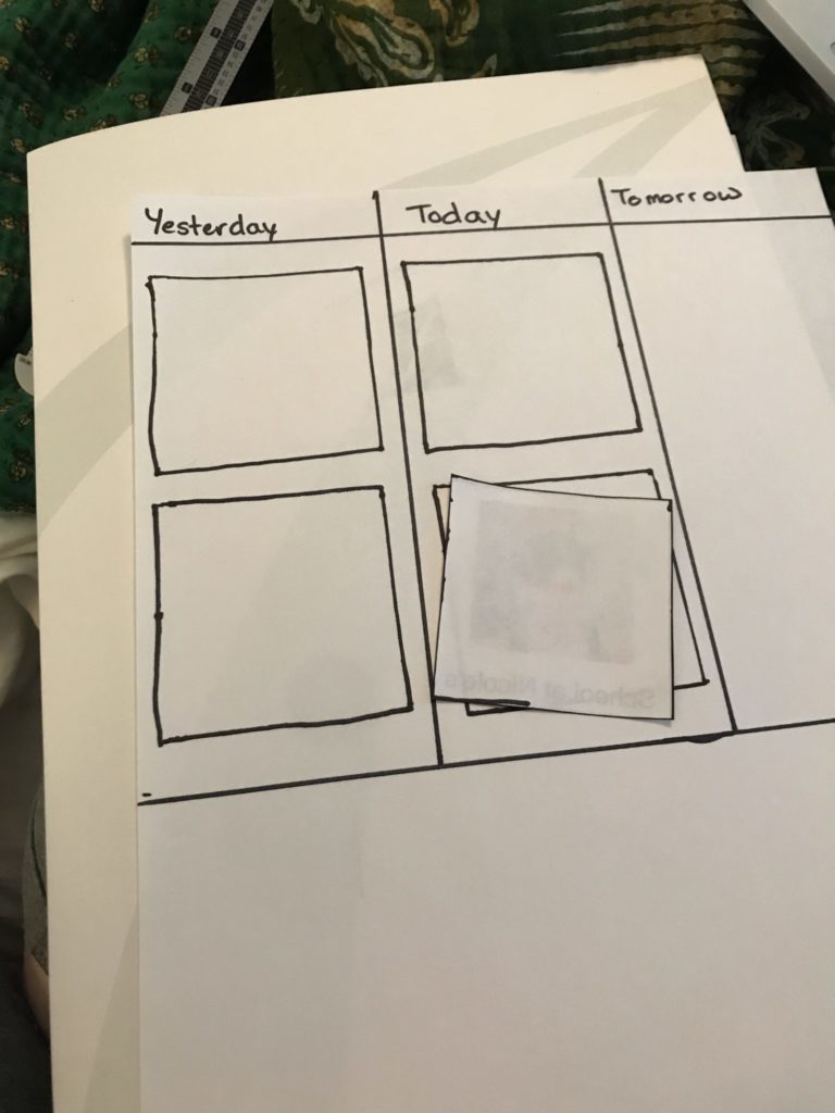 A photo of a partially completed visual schedule that is a white piece of paper with lines drawn on it and the headings "yesterday, today, and tomorrow"
