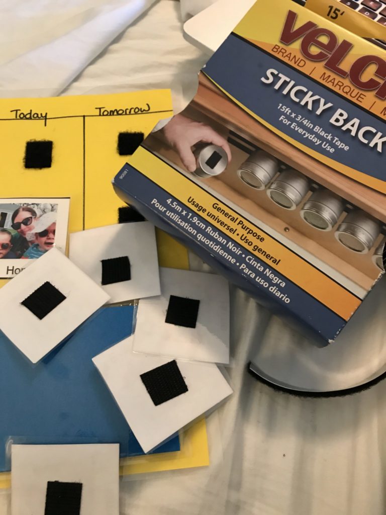 A photo of a box of sticky back velcro and a visual schedule and photos that have visible pieces of velcro stuck to them